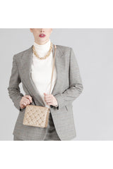 CafèNoir mini bag glitterata con borchie esagonali oro